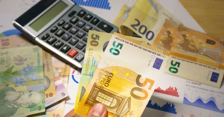 A calculator resting on a spread of euro banknotes
