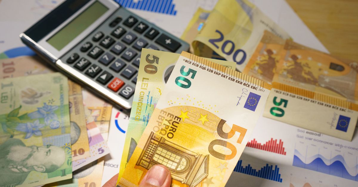 A calculator resting on a spread of euro banknotes