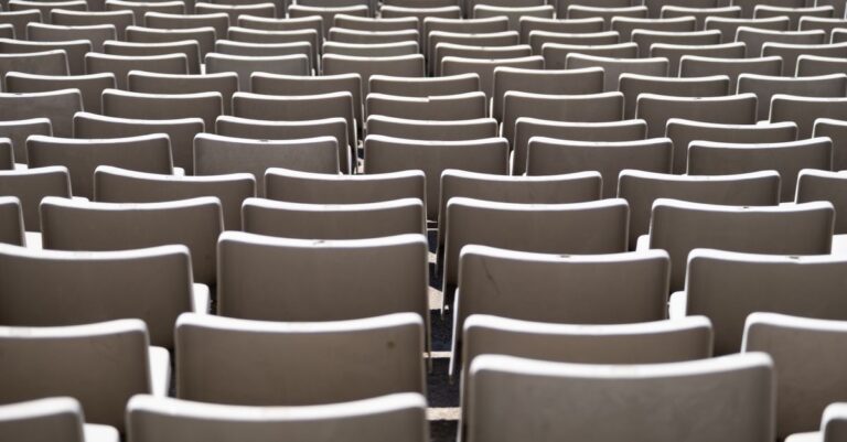 Rows of empty seats in an auditorium