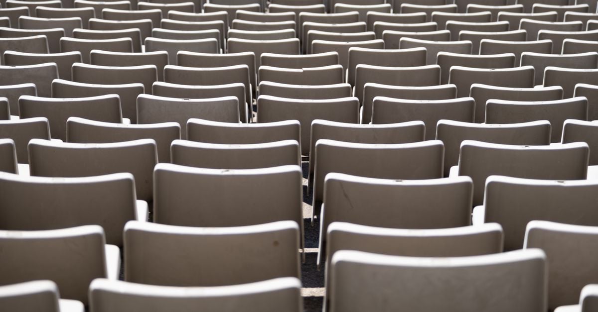 Rows of empty seats in an auditorium